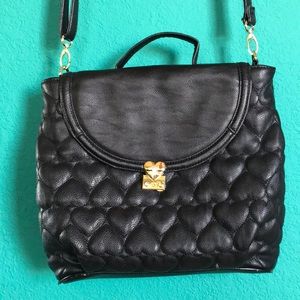Black Betsy Johnson messenger bag, heart pattern